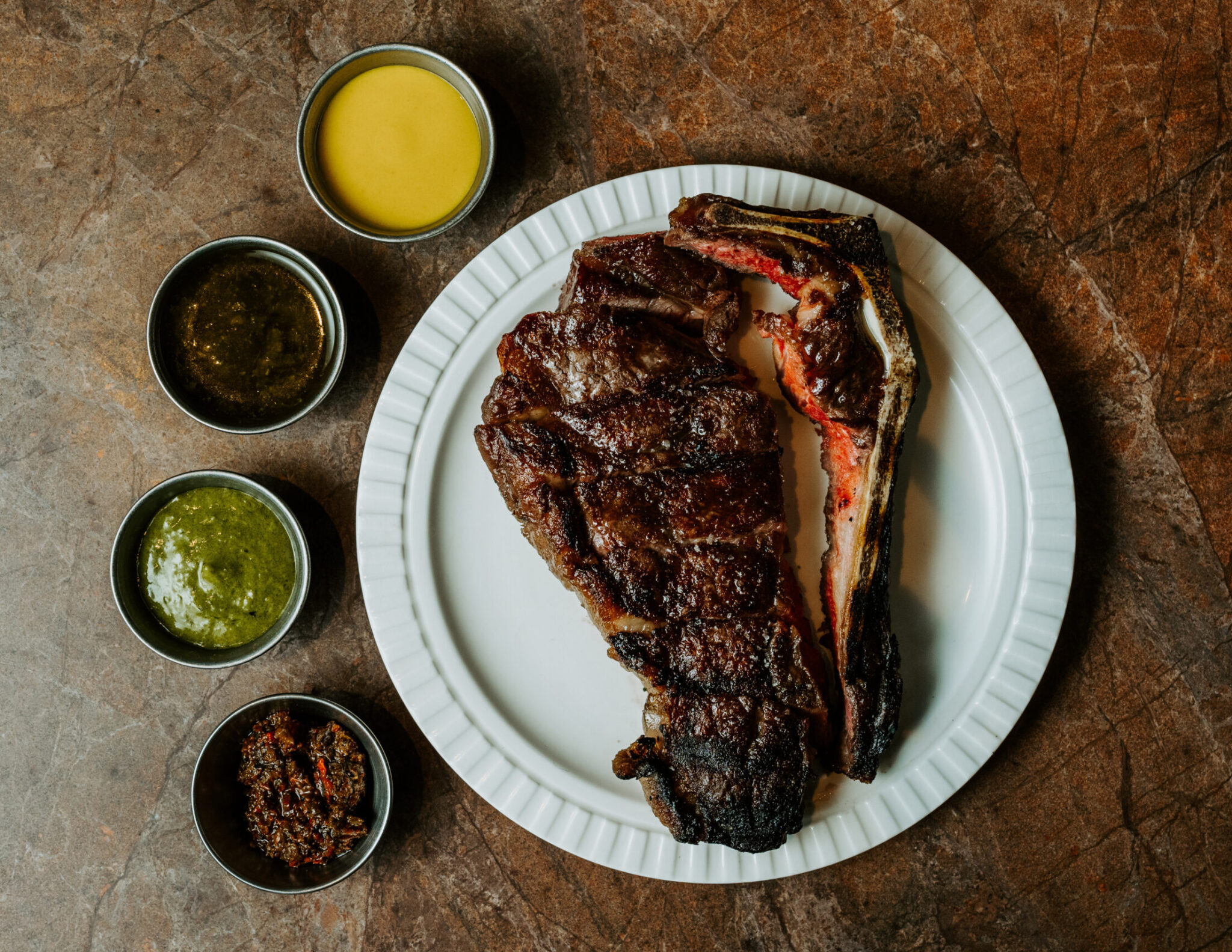 Grilled steak with condiments at Morena